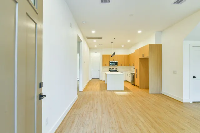 a view of kitchen with wooden floor