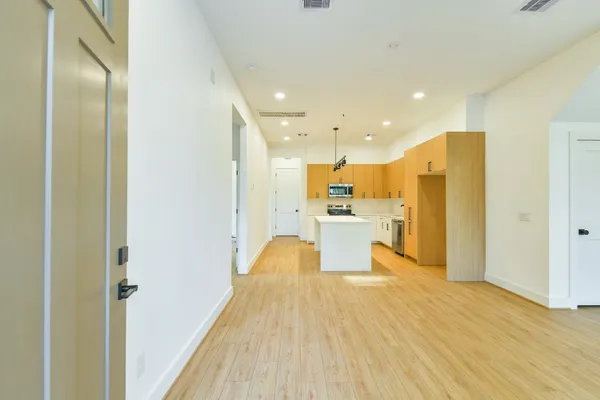 a view of kitchen with wooden floor