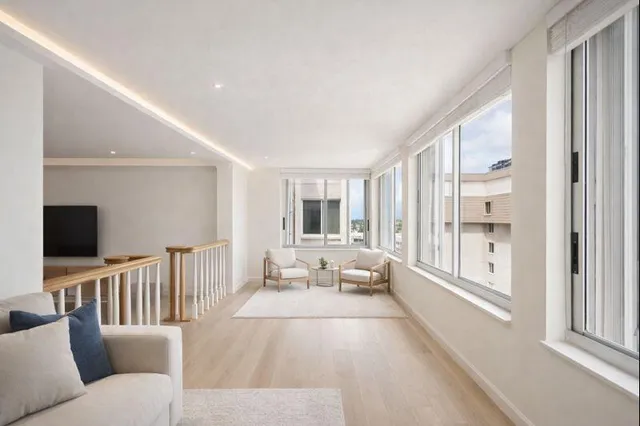 a bedroom with a bed and a lamp