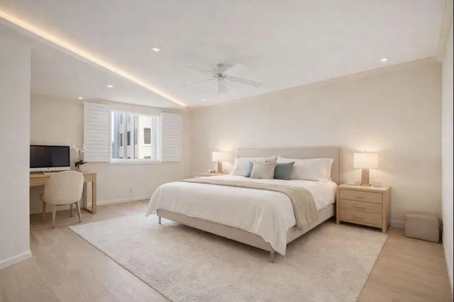 a bedroom with a bed and a table