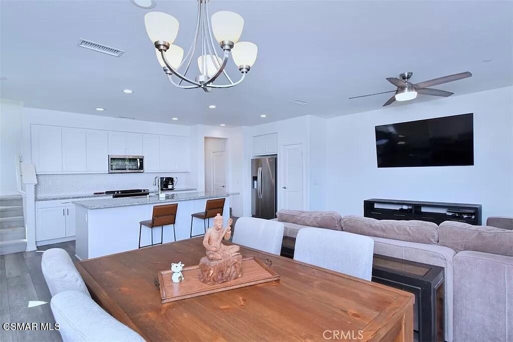 207 Morro Way, Unit 3 Simi Valley, CA 93065 - Photo 4 of 31 a living room with fireplace furniture and a flat screen tv