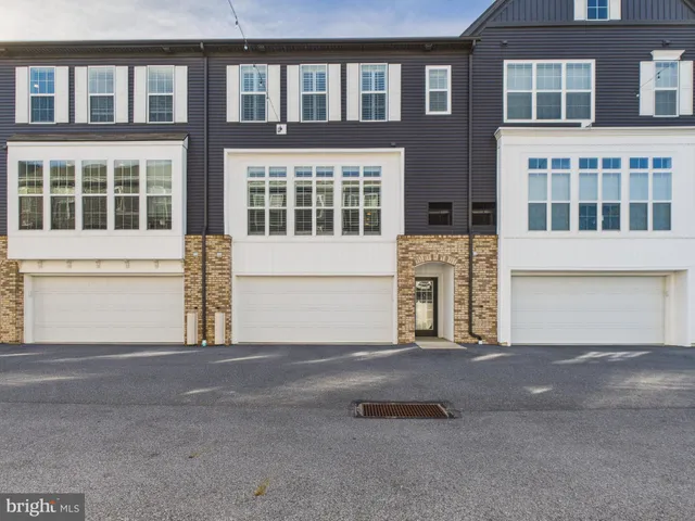 a front view of a building with a street