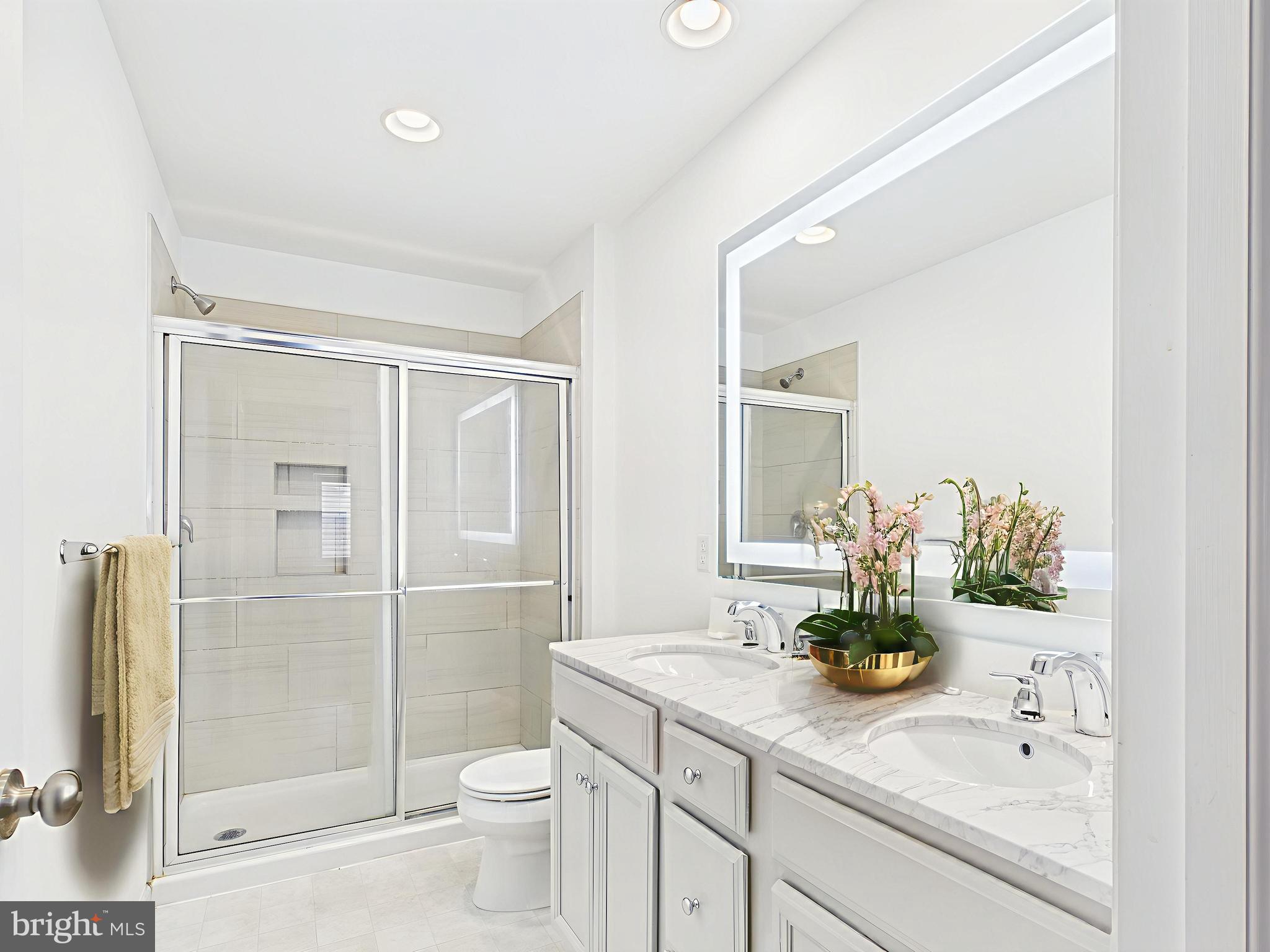 418 Mayer Place Lancaster, PA 17601 - Photo 5 of 15 a bathroom with a granite countertop sink a toilet and shower
