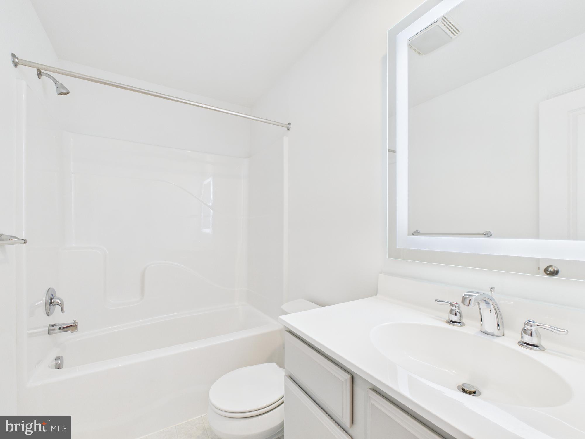 418 Mayer Place Lancaster, PA 17601 - Photo 9 of 15 a bathroom with a bathtub shower sink vanity and toilet