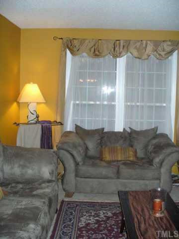 6008 Sandy Raleigh, NC 27610 - Photo 3 of 3 a living room with furniture and a lamp