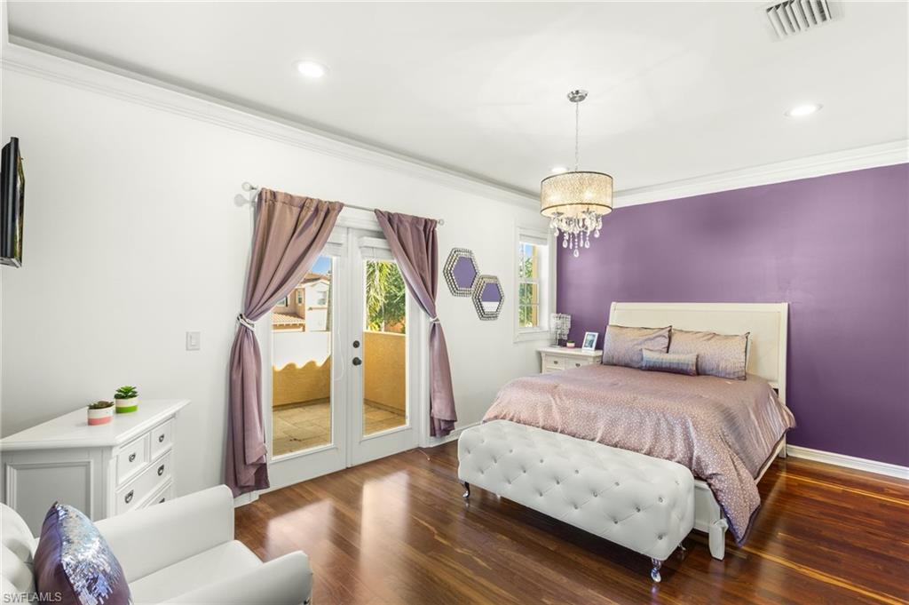 2135 Par Drive Naples, FL 34120 - Photo 14 of 46 a bedroom with a bed couch and a window