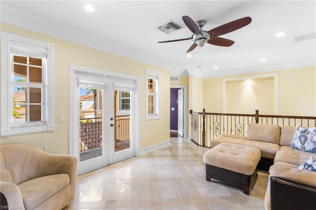 2135 Par Drive Naples, FL 34120 - Photo 17 of 46 a living room with furniture and a ceiling fan