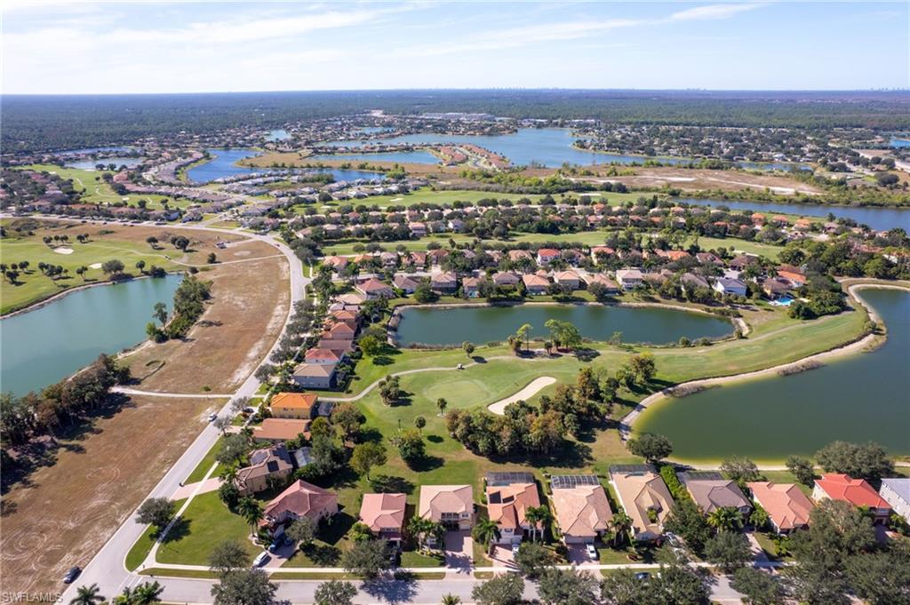 2135 Par Drive Naples, FL 34120 - Photo 2 of 46 an aerial view of lake residential houses with outdoor space