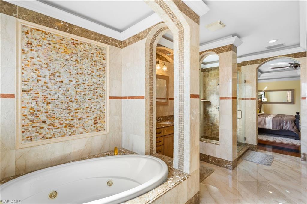 2135 Par Drive Naples, FL 34120 - Photo 22 of 46 a bathroom with a bathtub and a shower