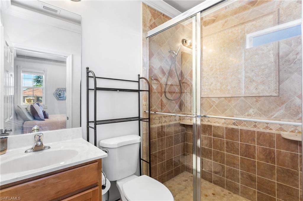 2135 Par Drive Naples, FL 34120 - Photo 24 of 46 a bathroom with a sink toilet and shower
