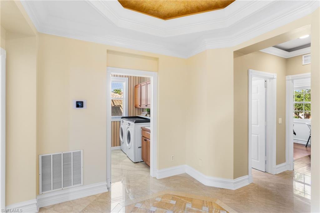 2135 Par Drive Naples, FL 34120 - Photo 30 of 46 a view of walk in closet with living room