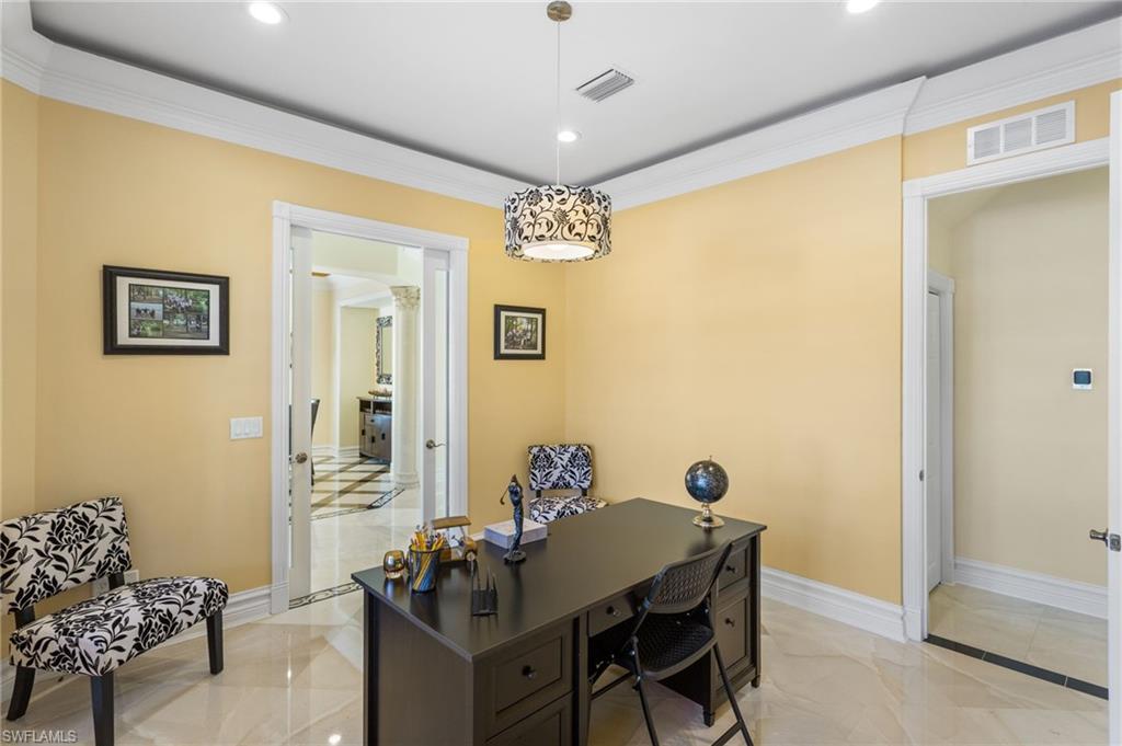 2135 Par Drive Naples, FL 34120 - Photo 34 of 46 a view of a dining room with furniture and chandelier