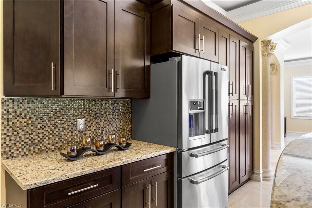 2135 Par Drive Naples, FL 34120 - Photo 36 of 46 a kitchen with stainless steel appliances granite countertop a refrigerator and a sink