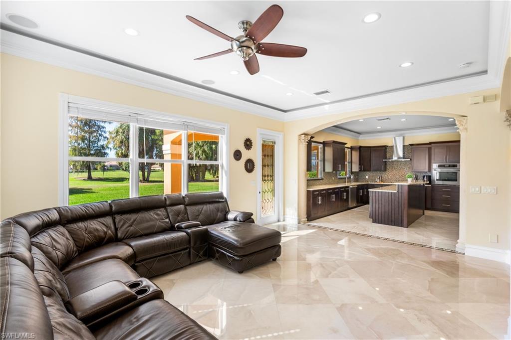 2135 Par Drive Naples, FL 34120 - Photo 40 of 46 a living room with furniture and a large window