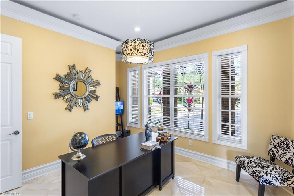2135 Par Drive Naples, FL 34120 - Photo 5 of 46 a living room with furniture and a chandelier