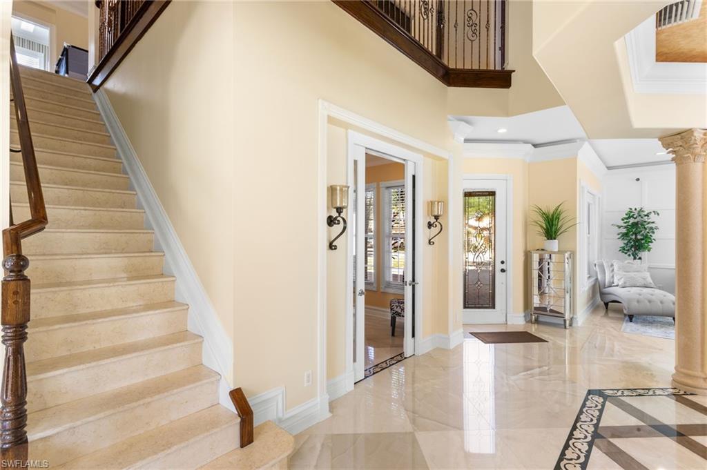 2135 Par Drive Naples, FL 34120 - Photo 8 of 46 a view of a hallway with wooden floor and entryway