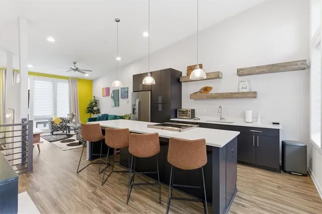a large kitchen with a table and chairs