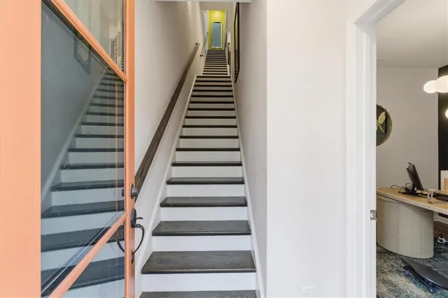 a view of entryway and gallery with wooden floor