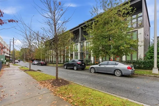 a view of street with parked cars