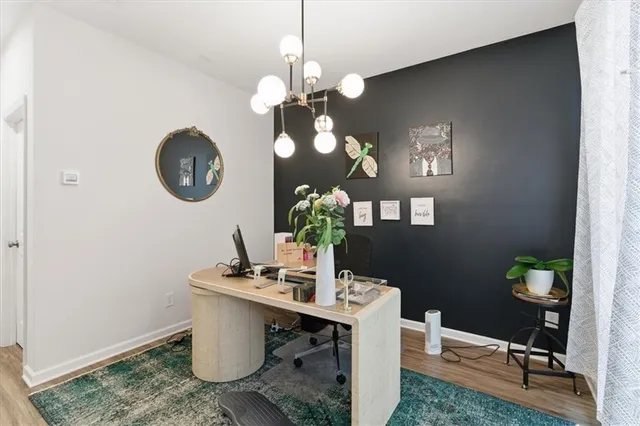 a view of a workspace with furniture