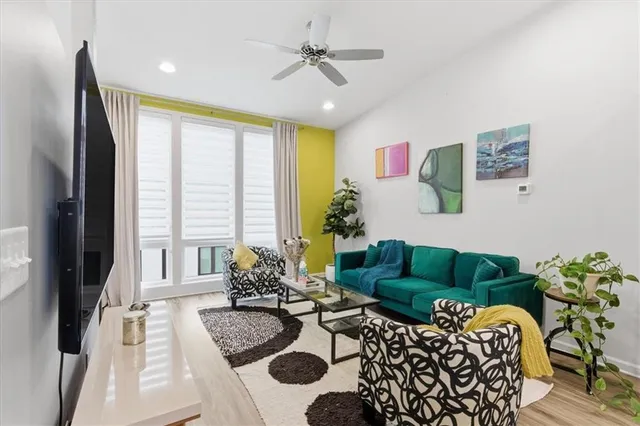 a living room with furniture and a large window