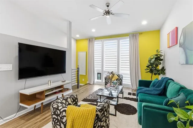 a living room with furniture and a flat screen tv