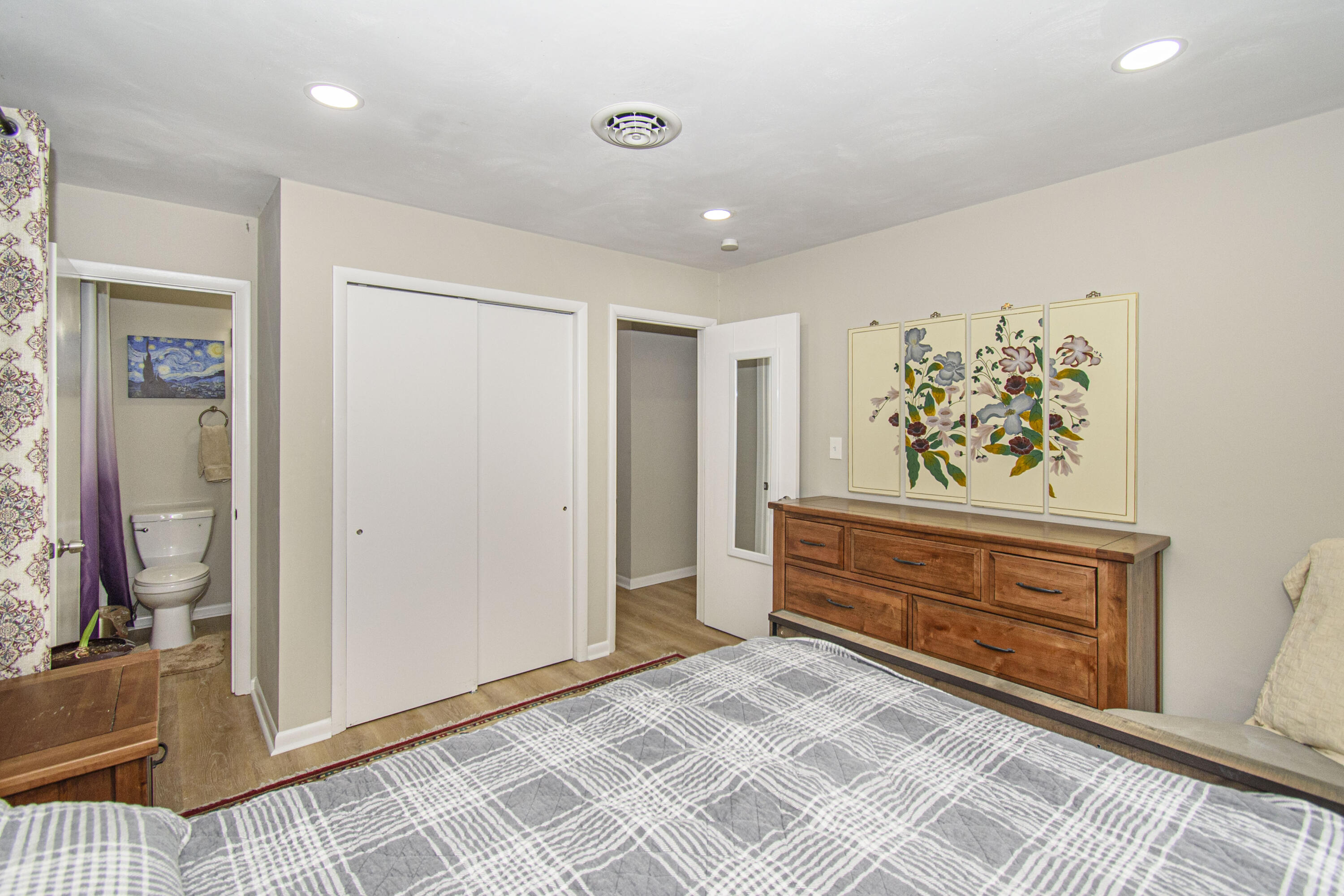 2801 Flatwoods Road Elliston, VA 24087 - Photo 16 of 56 a view of a bedroom with wooden floor and hallway