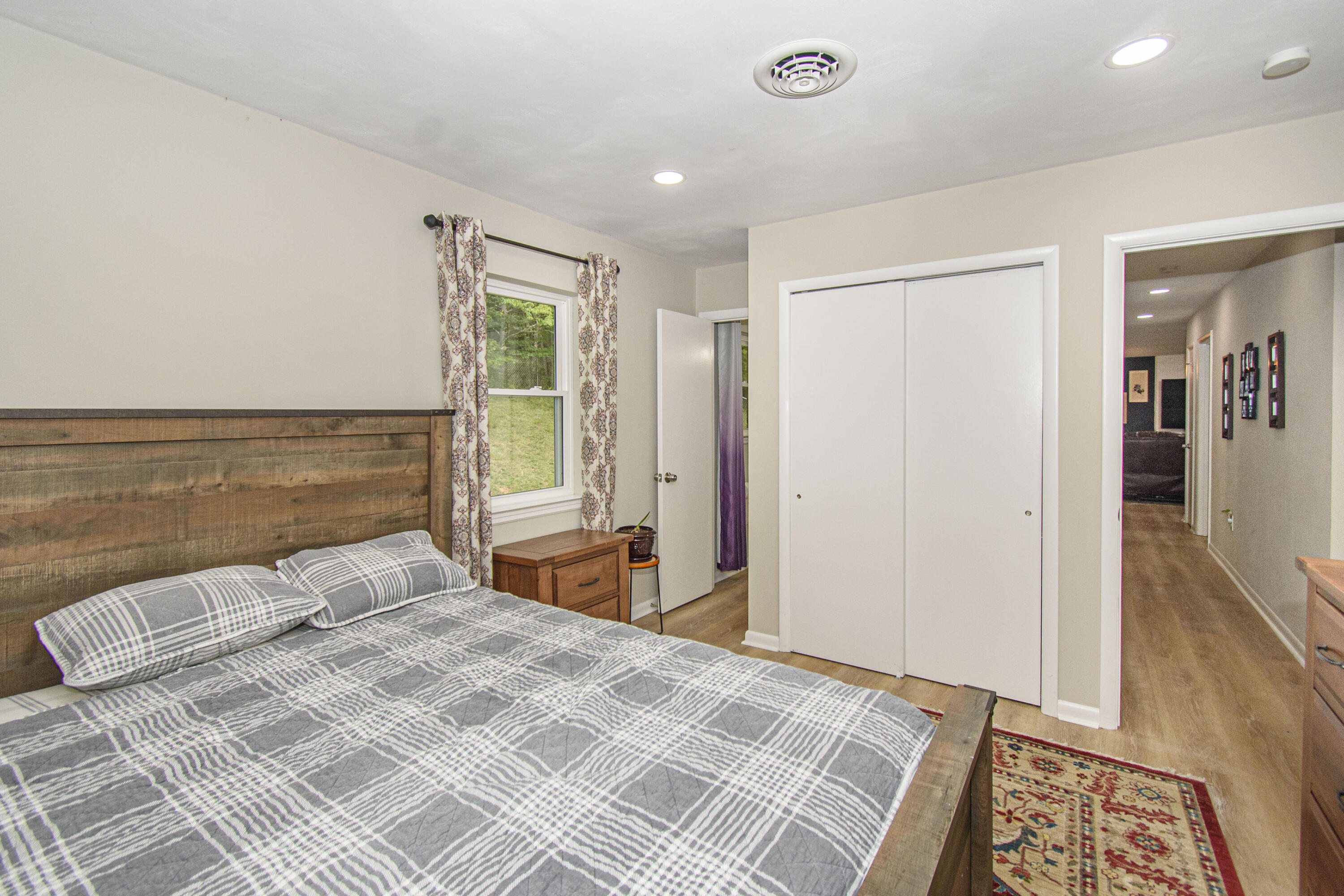 2801 Flatwoods Road Elliston, VA 24087 - Photo 17 of 56 a bedroom with a bed and a window