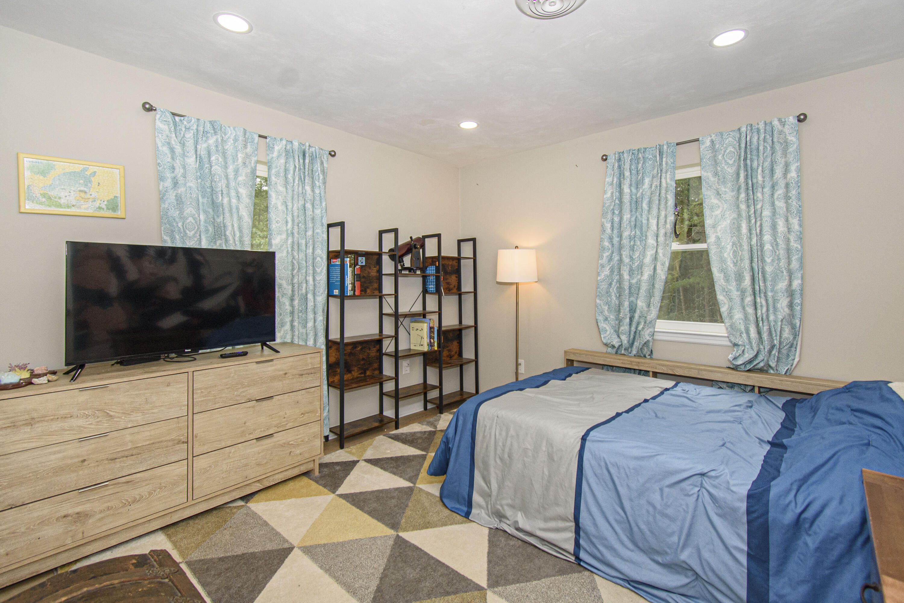 2801 Flatwoods Road Elliston, VA 24087 - Photo 19 of 56 a bedroom with a bed and a flat screen tv