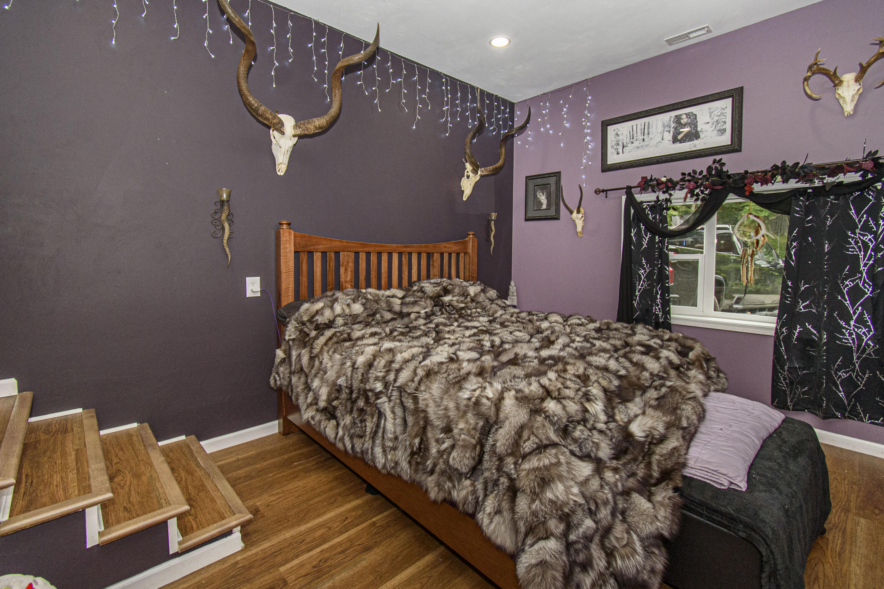 2801 Flatwoods Road Elliston, VA 24087 - Photo 23 of 56 a bed sitting in a bedroom next to a window