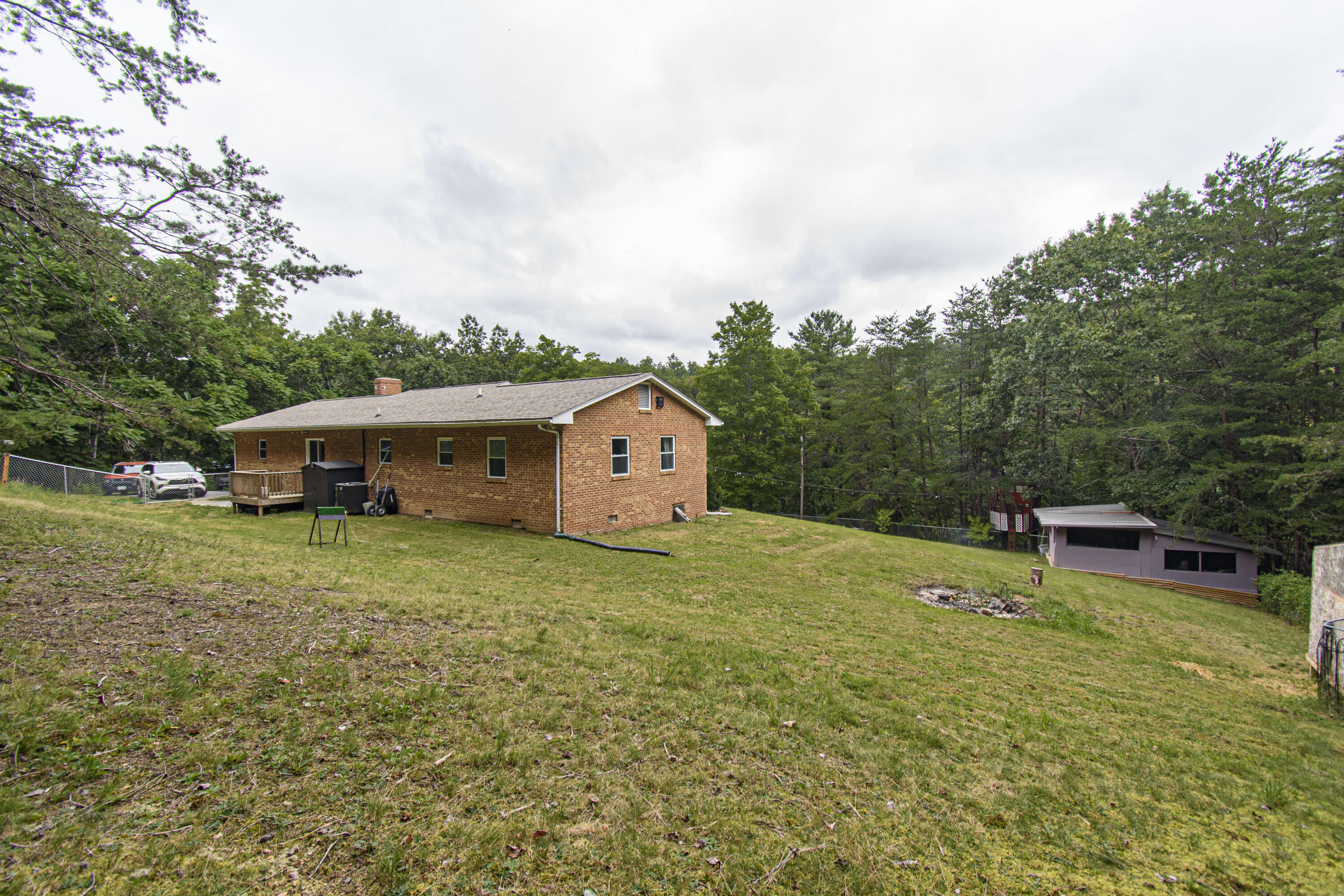 2801 Flatwoods Road Elliston, VA 24087 - Photo 41 of 56 a backyard of a house with table and chairs