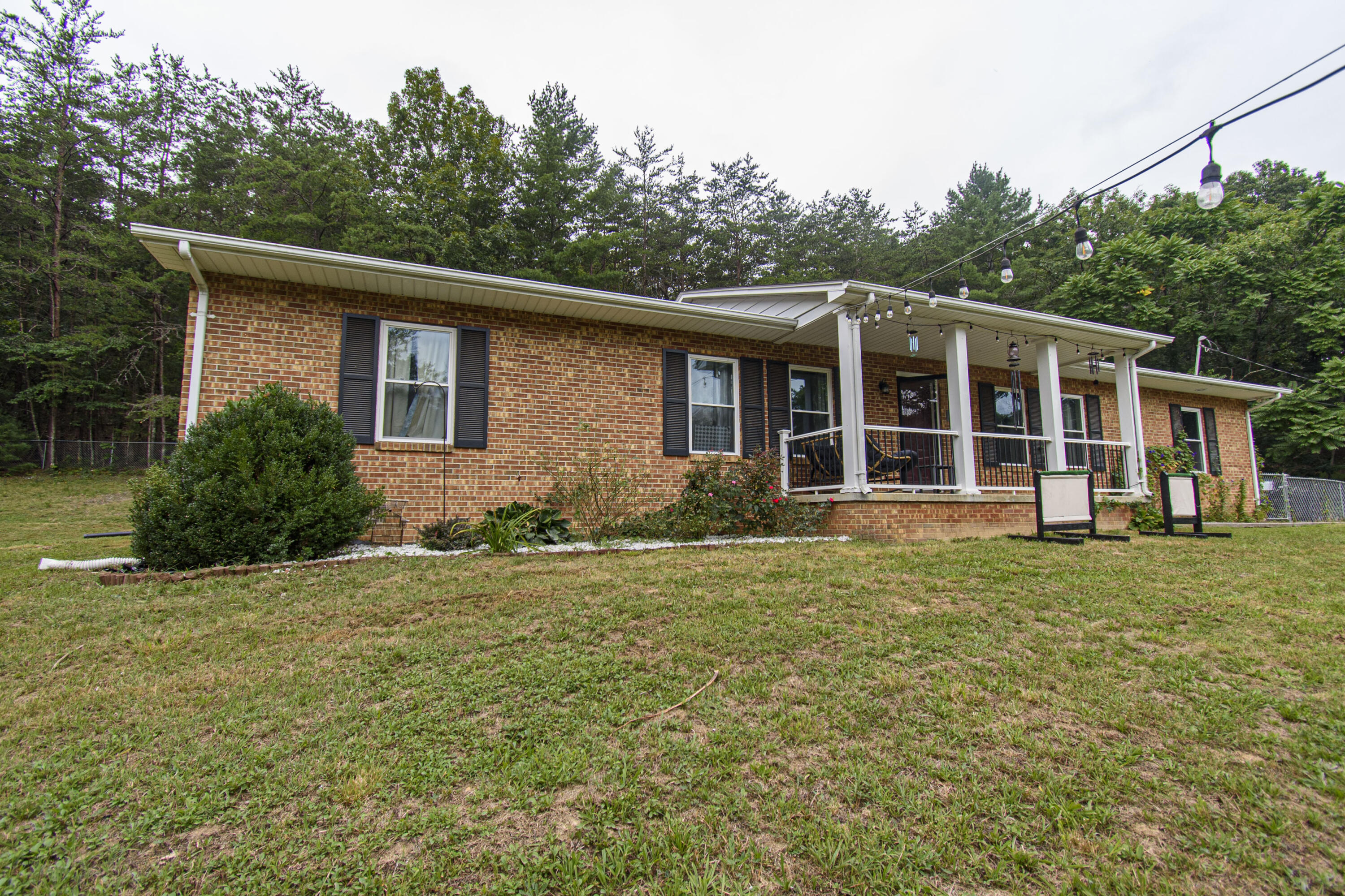 2801 Flatwoods Road Elliston, VA 24087 - Photo 45 of 56 a front view of a house with a garden