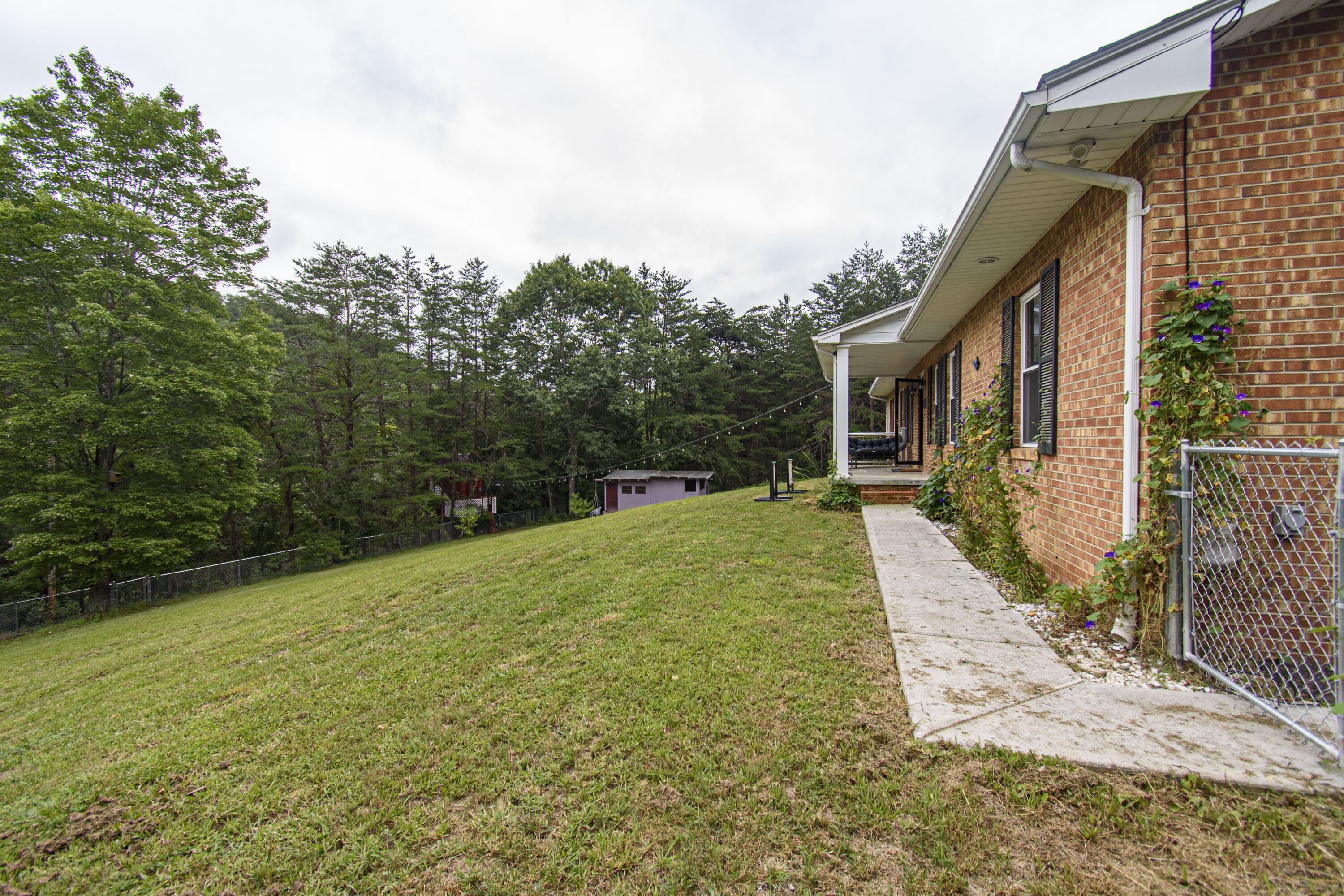 2801 Flatwoods Road Elliston, VA 24087 - Photo 47 of 56 a backyard of a house with lots of green space