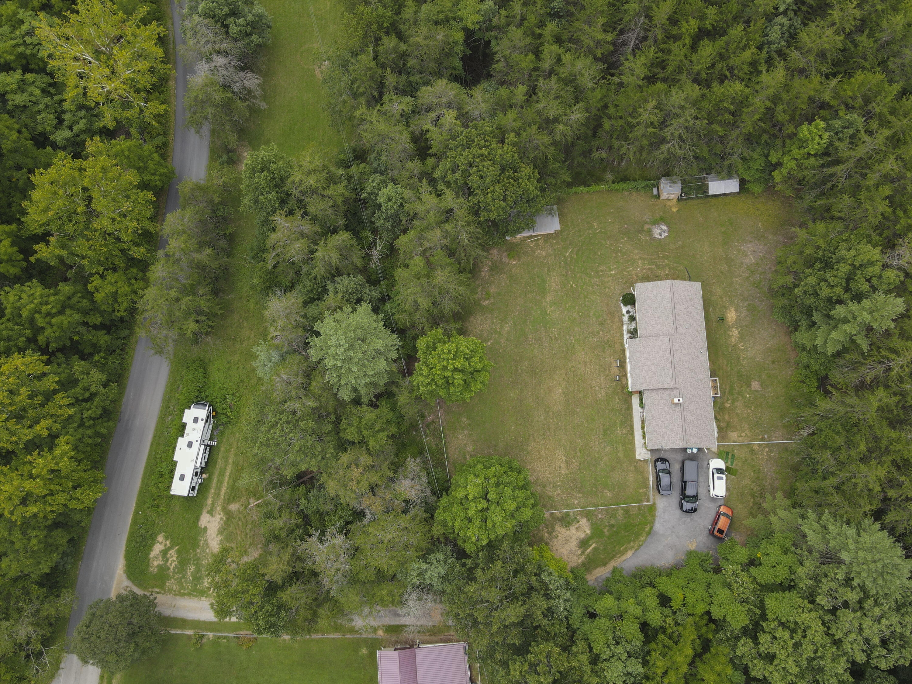 2801 Flatwoods Road Elliston, VA 24087 - Photo 52 of 56 an aerial view of a house with a yard and lake view