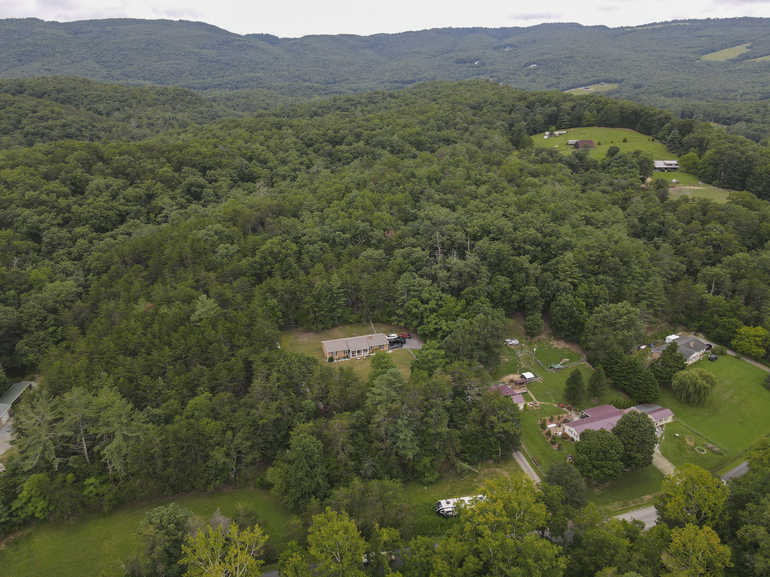 2801 Flatwoods Road Elliston, VA 24087 - Photo 56 of 56 a view of a lush green hillside and houses