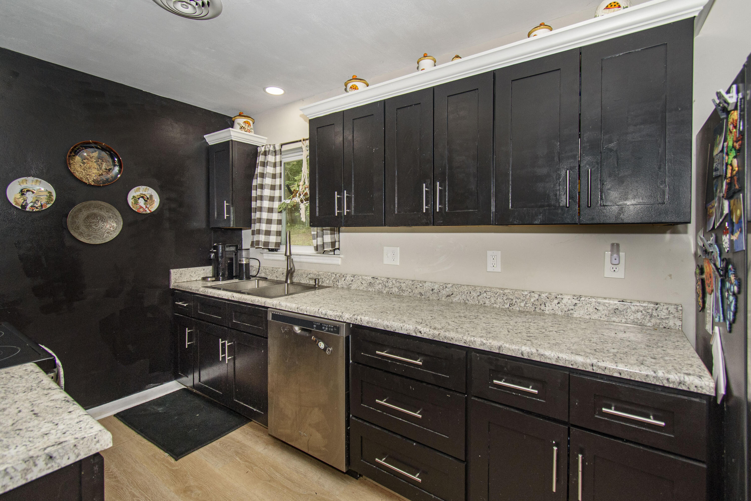 2801 Flatwoods Road Elliston, VA 24087 - Photo 9 of 56 a kitchen with a sink and a refrigerator
