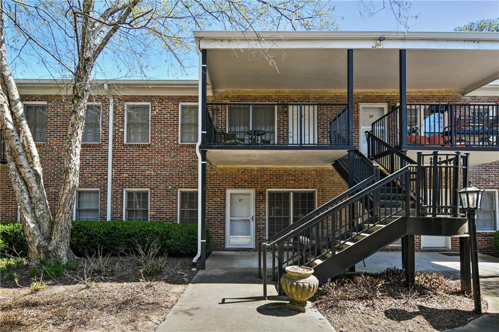 a balcony with table and chairs