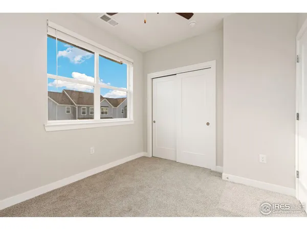 a bathroom with a granite countertop toilet sink and bathtub