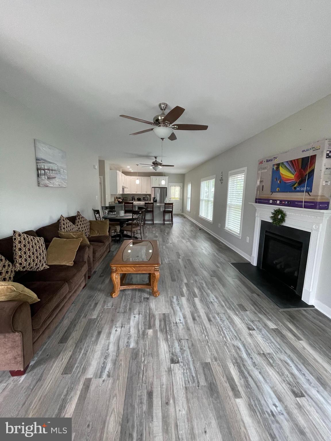 325 2nd Street Colonial Beach, VA 22443 - Photo 13 of 14 a living room with furniture and a fireplace