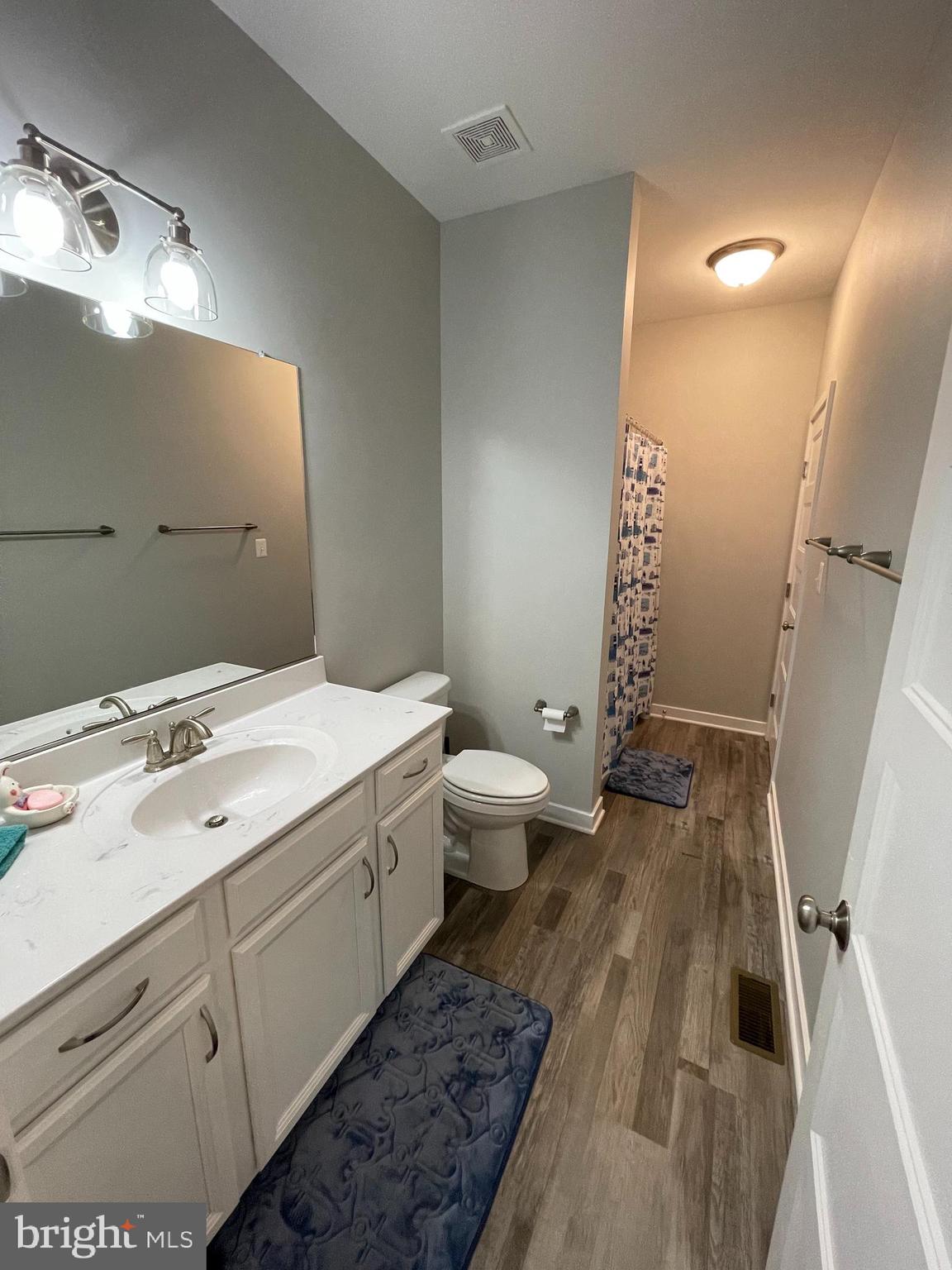 325 2nd Street Colonial Beach, VA 22443 - Photo 8 of 14 a bathroom with a sink a toilet and shower