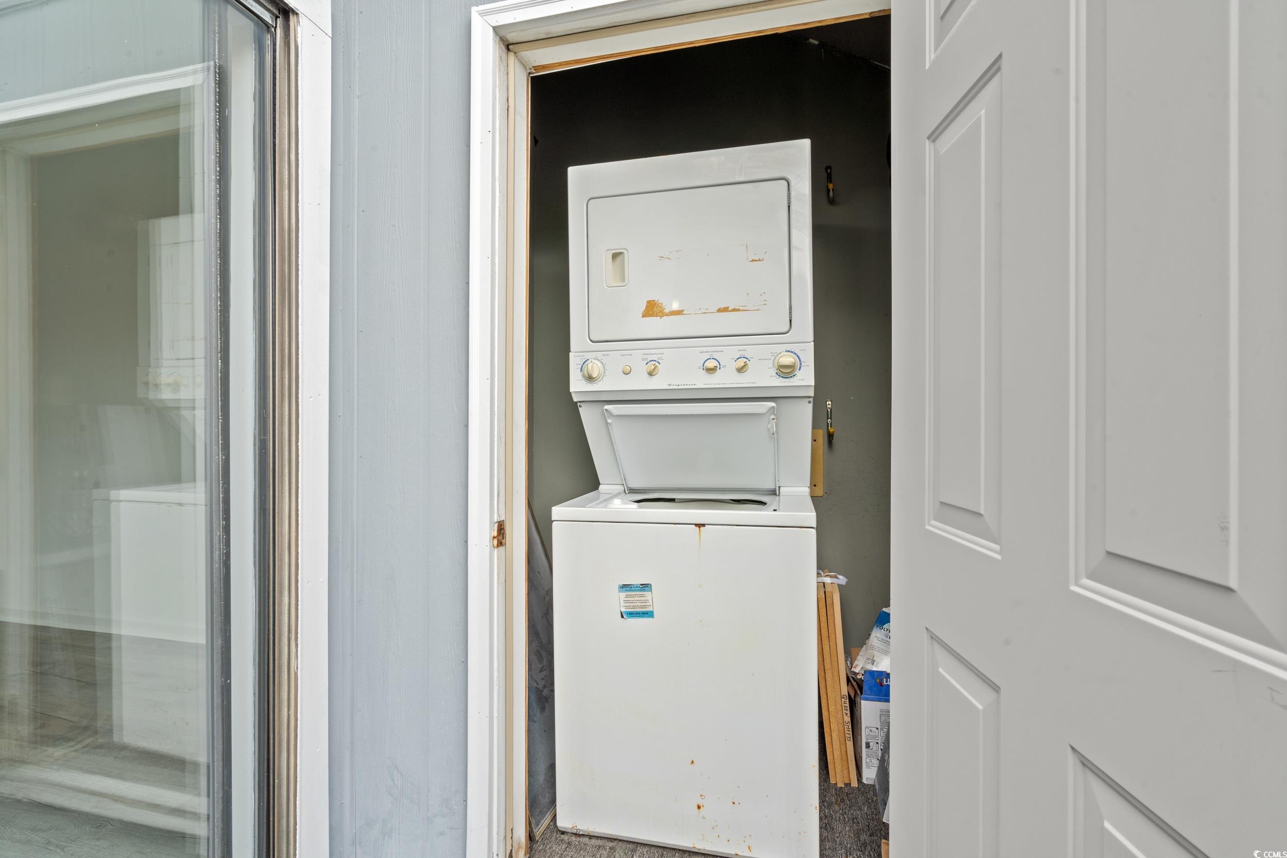 1890 Colony Drive, Unit 17L Surfside Beach, SC 29575 - Photo 27 of 38 Laundry room featuring stacked washer / drying machine