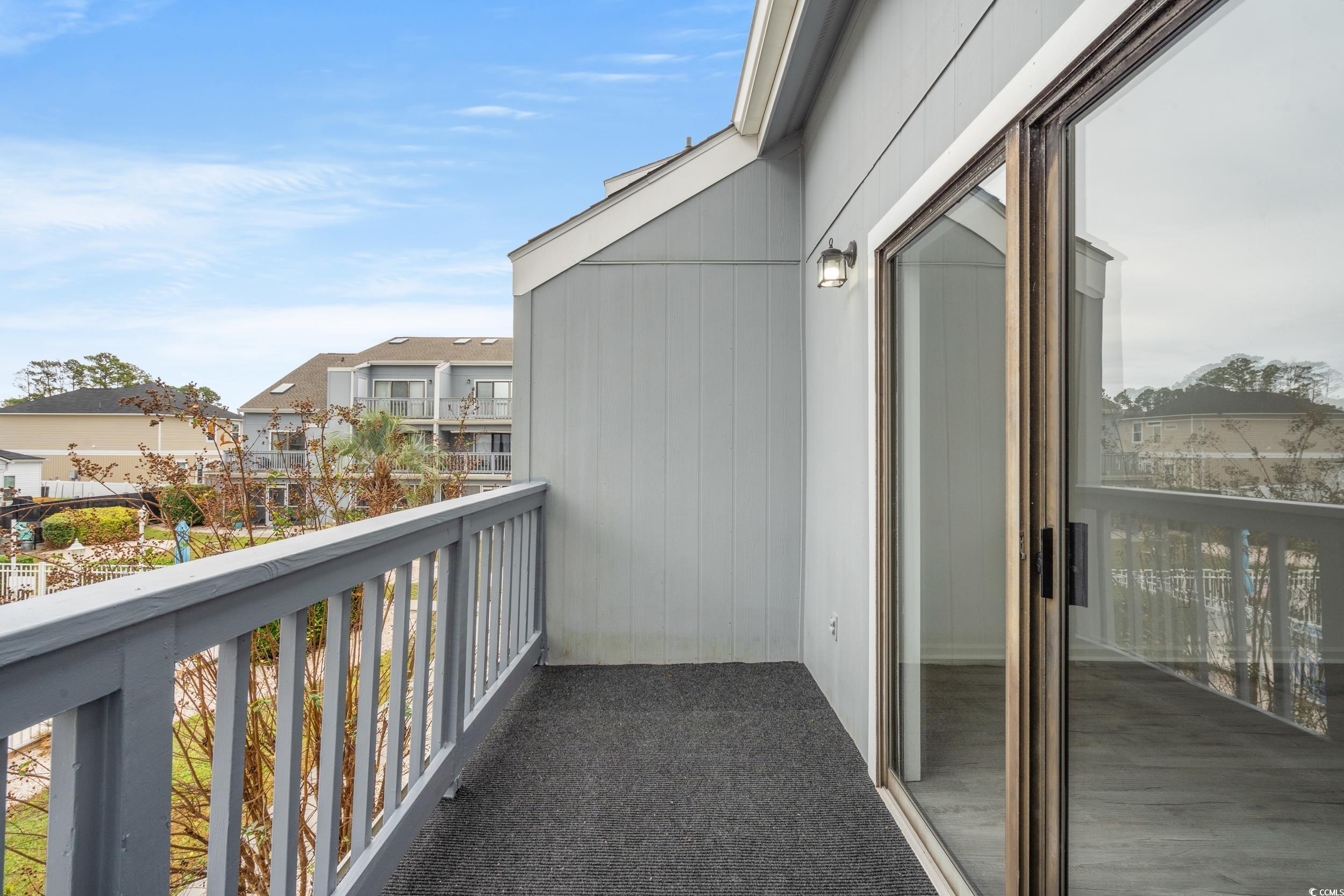 1890 Colony Drive, Unit 17L Surfside Beach, SC 29575 - Photo 30 of 38 Balcony with a residential view