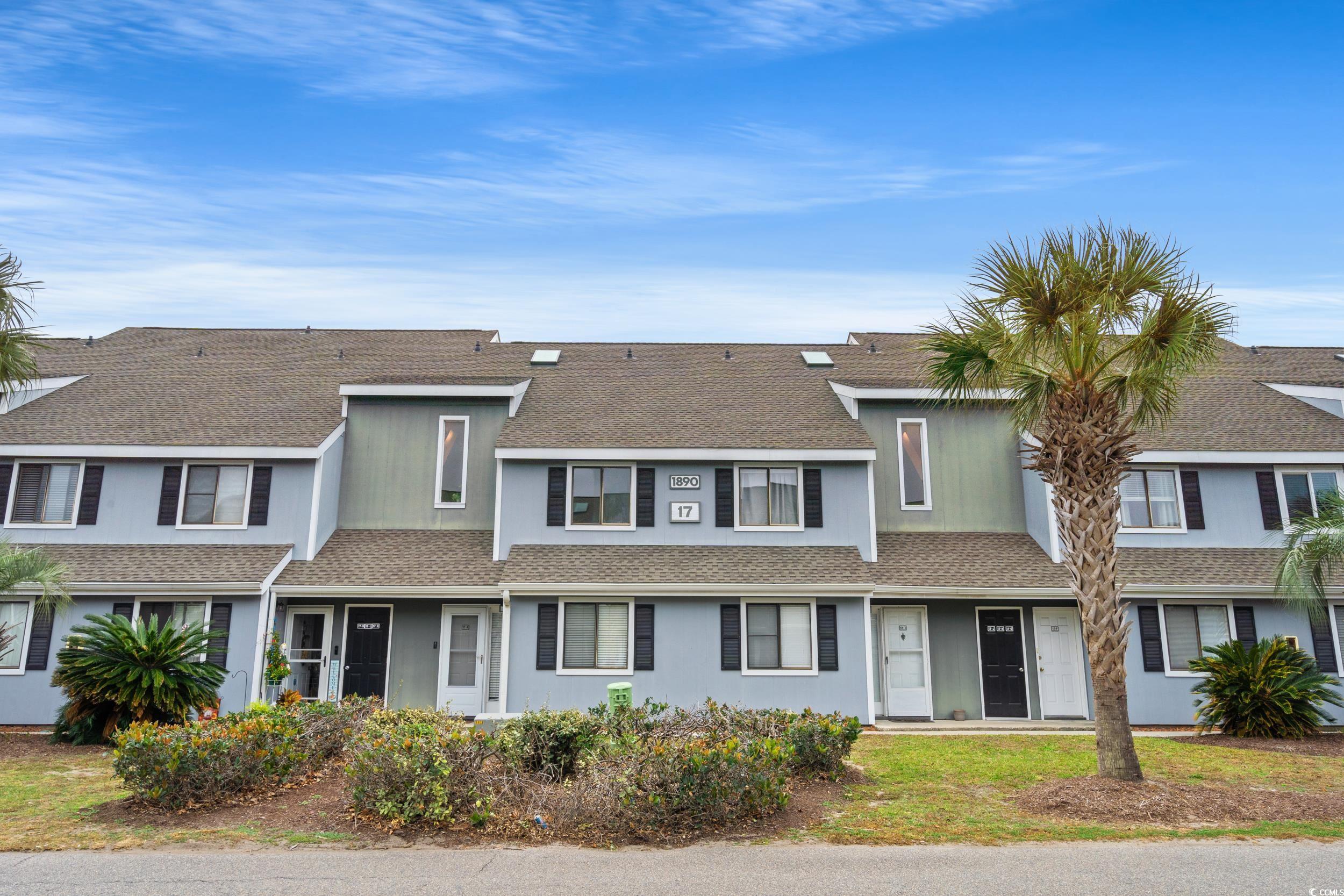 1890 Colony Drive, Unit 17L Surfside Beach, SC 29575 - Photo 3 of 38 Traditional-style house with a shingled roof