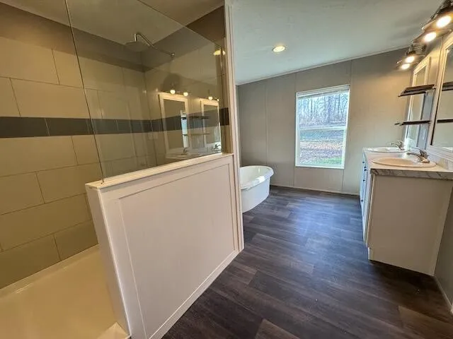 a bathroom with a double vanity sink toilet and shower