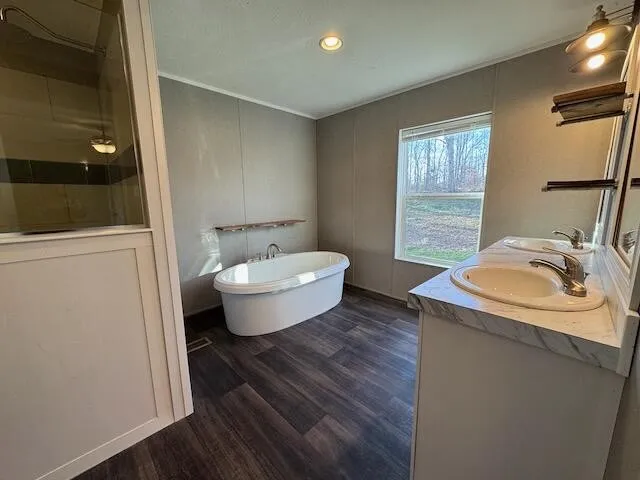 a bathroom with a double vanity sink and mirror
