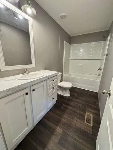 a view of yard with swimming pool and trees in the background