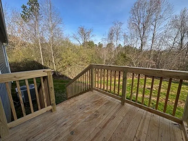 a view of a house with backyard and porch