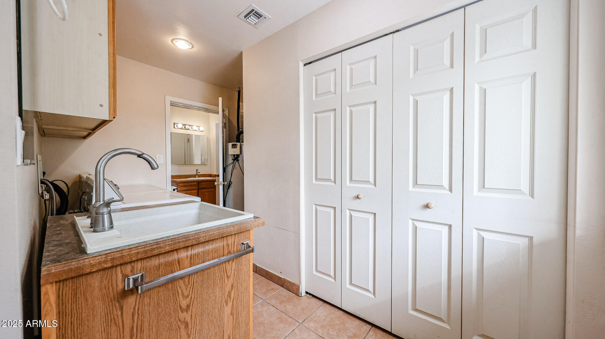 11851 North Thunderbird Road Sun City, AZ 85351 - Photo 32 of 46 a bathroom with a sink and a mirror