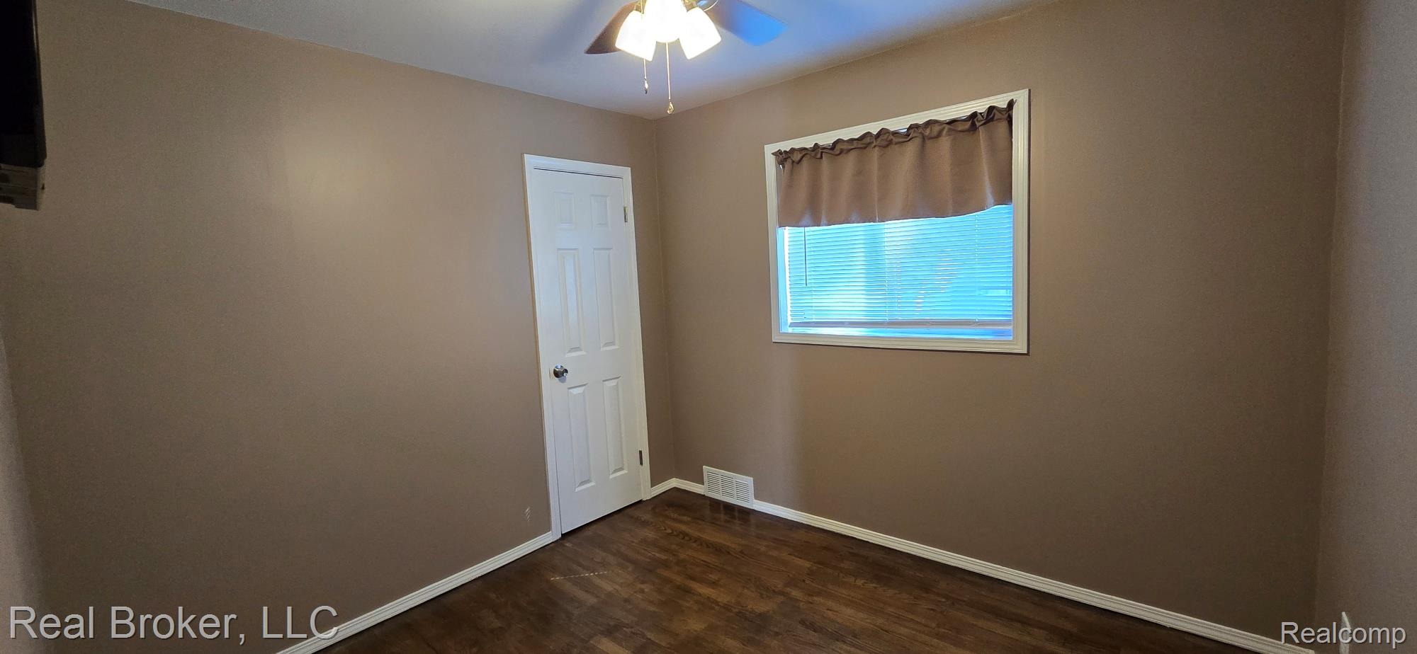 23401 Filmore Street Taylor, MI 48180 - Photo 11 of 16 Interior room featuring neutral wall paint, wood-finish flooring, and white trim