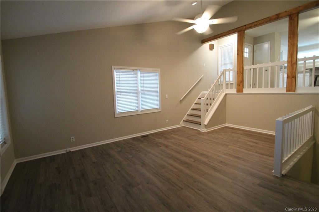 28006 Marina Drive, Unit 6 Tega Cay, SC 29708 - Photo 12 of 32 wooden floor in an empty room with a window